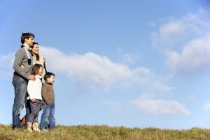 family standing in the park